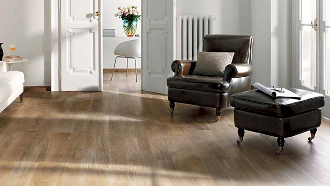 Engineerd wood flooring with brown chair and white doors