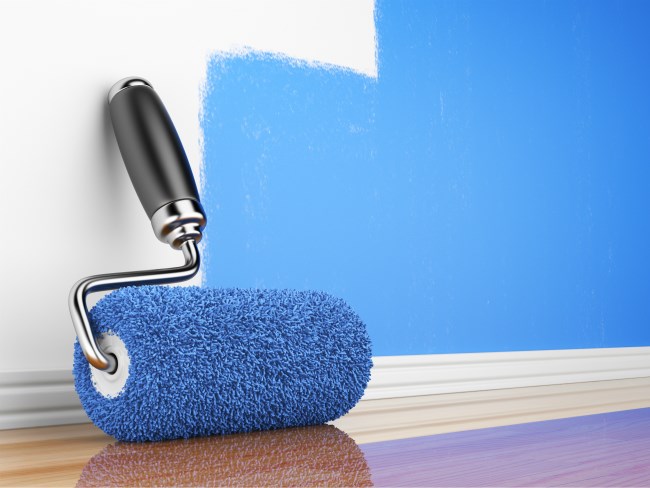 Blue paint, white wall, paint brush