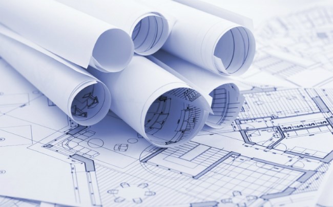 planning permission documents for a home extension rolled up