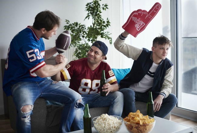 men watching sports game in lounge