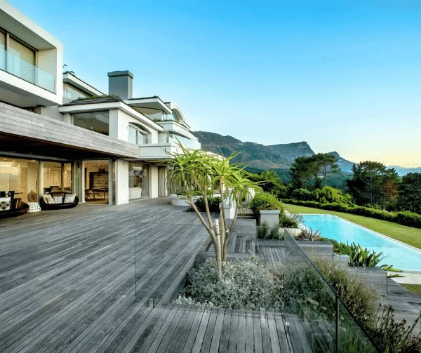 This stunning home in Constantia, Cape Town features a beautifully landscaped garden and endless scenic views.
