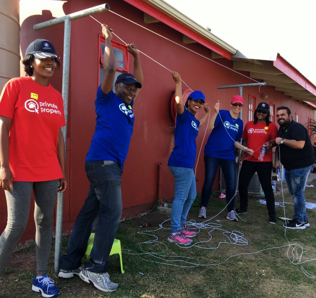 The Private Property team installing new washing lines at LIV Village