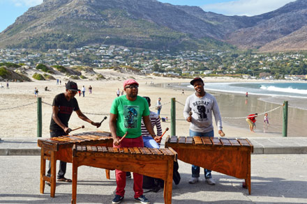 Street performers on the beach in Hout Bay