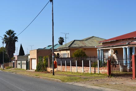 A residential street with homes in Springs