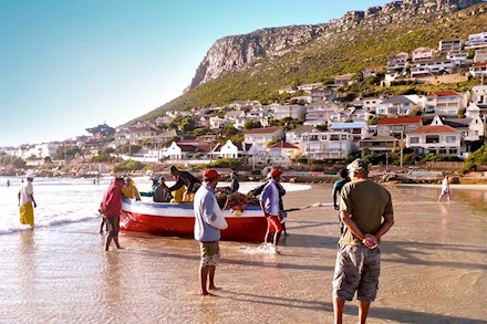 Fisherman in the harbour at False Bay