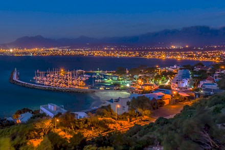 Aerial view of the harbour at night in Gordons Bay 