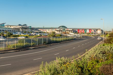 View of a shopping centre and street in Brackenfell