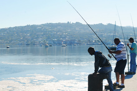 Fisherman fishing in the ocean in Knysna