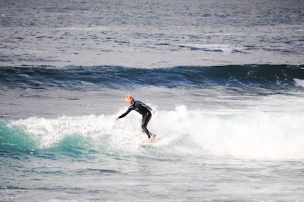 Surfing in the ocean in Mossel Bay to Glentana