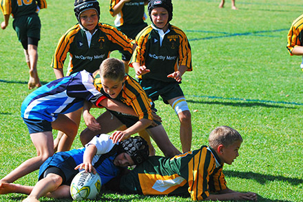 School boys playing rugby at Midstream Primary in Centurion East